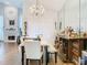 Bright dining room features a chandelier, stylish furniture, and an adjacent bar area for entertaining at 3408 Idlegrove Ct, Orlando, FL 32822