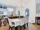 An elegant dining room with a large mirror reflecting the open-concept living space at 3408 Idlegrove Ct, Orlando, FL 32822