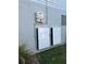 Image shows the home's Tesla Powerwall system with two white battery units mounted outside at 3408 Idlegrove Ct, Orlando, FL 32822