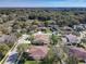 Wide shot of a residential neighborhood surrounded by mature trees and landscaping at 3620 Chandler Estates Dr, Apopka, FL 32712