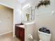 Bathroom featuring vanity with dark wood cabinets, updated light fixtures at 3620 Chandler Estates Dr, Apopka, FL 32712