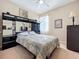 Comfortable bedroom featuring a ceiling fan and decorative black mirrored furniture at 3620 Chandler Estates Dr, Apopka, FL 32712