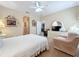 Bright bedroom with a ceiling fan, large dresser, and neutral decor at 3620 Chandler Estates Dr, Apopka, FL 32712
