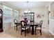 Elegant dining room with a large table, chandelier, and beautiful decor for memorable gatherings at 3620 Chandler Estates Dr, Apopka, FL 32712