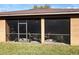 View of the screened lanai with outdoor seating, offering a relaxing extension of the living space at 3620 Chandler Estates Dr, Apopka, FL 32712