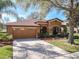 Beautiful home featuring a spacious driveway, two-car garage, and a well-maintained lawn at 3620 Chandler Estates Dr, Apopka, FL 32712