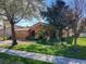 Charming single-story home with a well-manicured lawn and mature trees in a suburban setting at 3620 Chandler Estates Dr, Apopka, FL 32712