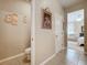Hallway leading to a bedroom, bathroom, and closet with tile flooring at 3620 Chandler Estates Dr, Apopka, FL 32712