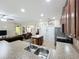Open floor plan displaying kitchen with granite counters and stainless appliances at 3620 Chandler Estates Dr, Apopka, FL 32712