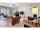 Inviting living space with plush seating and a view towards the outdoor patio and a TV at 3620 Chandler Estates Dr, Apopka, FL 32712