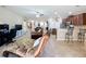 Open concept living room flowing to the kitchen and dining, with tile and carpet at 3620 Chandler Estates Dr, Apopka, FL 32712