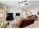 Comfortable living area with plush seating, television, and open access to other rooms at 3620 Chandler Estates Dr, Apopka, FL 32712