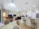 Open floor plan featuring dining area and kitchen bar looking into the living room at 3620 Chandler Estates Dr, Apopka, FL 32712