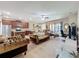 Open concept living room featuring plush seating, ceiling fan, and access to the patio at 3620 Chandler Estates Dr, Apopka, FL 32712