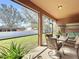The screened patio includes an outdoor dining area and a view of the backyard at 3620 Chandler Estates Dr, Apopka, FL 32712