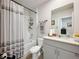 Bathroom featuring a shower over tub, granite countertops and toilet at 3764 Shoveler Ave, Leesburg, FL 34748
