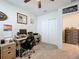 Bright bedroom features an office space and a view of the closet and dresser at 3764 Shoveler Ave, Leesburg, FL 34748