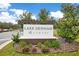 Lake Denham Estates community sign surrounded by manicured landscaping at 3764 Shoveler Ave, Leesburg, FL 34748