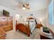 Comfortable main bedroom with a ceiling fan and wood furniture at 3764 Shoveler Ave, Leesburg, FL 34748