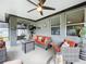 Covered patio area with stylish outdoor seating, ceiling fan, and a decorative nautical theme at 3764 Shoveler Ave, Leesburg, FL 34748