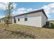 The home has a simple backyard with patio and a glass sliding door entry at 3872 Giorgio Dr, Winter Haven, FL 33884