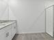 Elegant bathroom with a granite countertop vanity, modern fixtures, and a sleek glass-enclosed shower at 3872 Giorgio Dr, Winter Haven, FL 33884