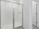 Modern bathroom featuring a glass-enclosed shower with tile surround at 3872 Giorgio Dr, Winter Haven, FL 33884