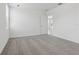 A well-lit bedroom with soft carpet, offering a serene and inviting space with a view of the door to a bathroom at 3872 Giorgio Dr, Winter Haven, FL 33884