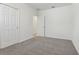 Bedroom with carpet flooring and two doors at 3872 Giorgio Dr, Winter Haven, FL 33884