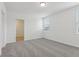 Neutral bedroom with a large window and soft carpet, offering a comfortable and inviting space at 3872 Giorgio Dr, Winter Haven, FL 33884