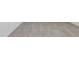 Close-up of stylish neutral tile flooring with clean white baseboards at 3872 Giorgio Dr, Winter Haven, FL 33884