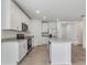 Bright kitchen with white cabinets, stainless steel appliances, and granite countertops at 3872 Giorgio Dr, Winter Haven, FL 33884