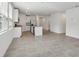 Open concept kitchen boasts white cabinets, stainless steel appliances, and a central island at 3872 Giorgio Dr, Winter Haven, FL 33884
