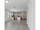 Bright kitchen and living area featuring tile floors and modern stainless steel appliances at 3872 Giorgio Dr, Winter Haven, FL 33884