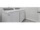 Laundry room featuring new Whirlpool washer and dryer at 3872 Giorgio Dr, Winter Haven, FL 33884