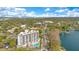 Beautiful aerial view of the building showcasing its architecture and proximity to the lake, surrounded by mature trees at 401 E Robinson St # 202, Orlando, FL 32801
