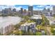 Stunning aerial view of the property showcasing its prime location near the lake and city skyline, surrounded by lush greenery at 401 E Robinson St # 202, Orlando, FL 32801