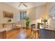 Cozy bedroom features neutral walls, hardwood floors, a ceiling fan, and ample natural light at 401 E Robinson St # 202, Orlando, FL 32801