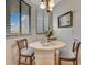 Bright breakfast nook with large windows and intimate seating for two at 401 E Robinson St # 202, Orlando, FL 32801
