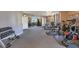 Spacious gym featuring a variety of exercise equipment, large mirror and ample natural light from large windows at 401 E Robinson St # 202, Orlando, FL 32801