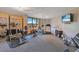 Well-equipped gym featuring weightlifting station, stationary bikes, treadmill and a large window with scenic outside views at 401 E Robinson St # 202, Orlando, FL 32801
