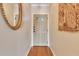 Hallway featuring hardwood floors with natural light and access to the front door at 401 E Robinson St # 202, Orlando, FL 32801