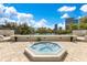 Outdoor hot tub with patio and views of the city buildings and puffy clouds in a blue sky at 401 E Robinson St # 202, Orlando, FL 32801