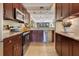 Modern kitchen with tiled backsplash, stainless appliances, and hardwood floors at 401 E Robinson St # 202, Orlando, FL 32801