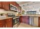 Beautiful kitchen with stainless steel appliances and tile backsplash detail at 401 E Robinson St # 202, Orlando, FL 32801