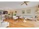 Open-concept living room featuring hardwood floors, elegant furnishings, and plenty of natural light at 401 E Robinson St # 202, Orlando, FL 32801