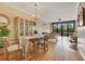 Open-concept living room with hardwood floors, comfortable seating, and city views through expansive windows at 401 E Robinson St # 202, Orlando, FL 32801