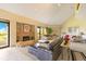 Living room features a fireplace, access to a balcony, and plenty of comfortable seating at 401 E Robinson St # 202, Orlando, FL 32801