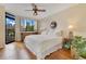 Inviting bedroom with a large window view, natural light, hardwood floors, and elegant decor at 401 E Robinson St # 202, Orlando, FL 32801