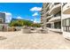 This home features a spacious patio with outdoor seating for relaxing and entertaining, set against a beautiful building exterior at 401 E Robinson St # 202, Orlando, FL 32801